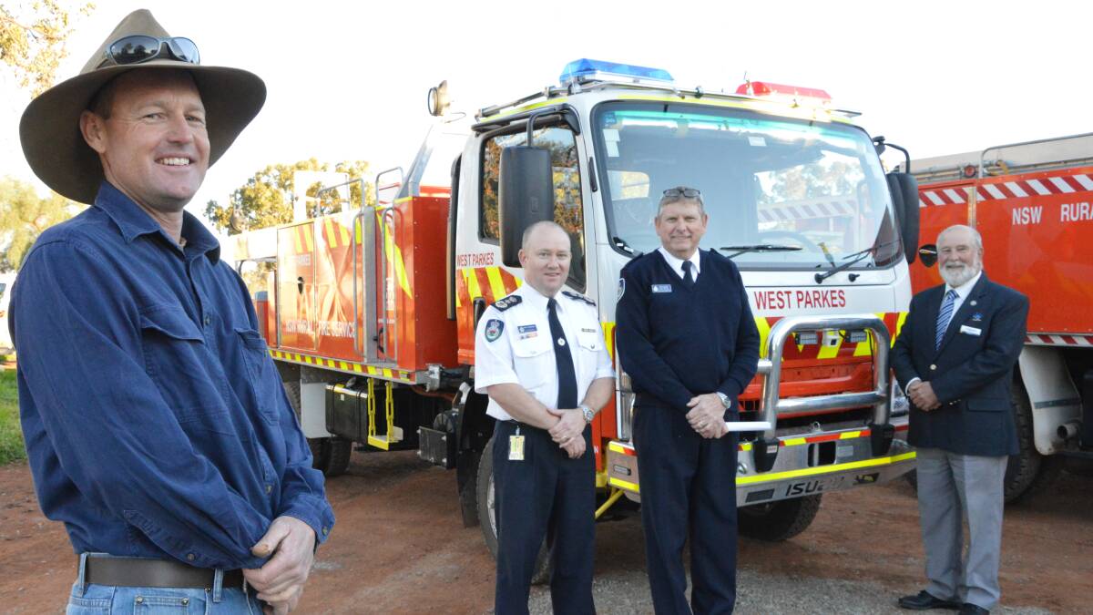 Glen Woods, Commissioner Shane Fitzsimmons, Ken Neville and Cr Ken Keith with one of the new tankers.