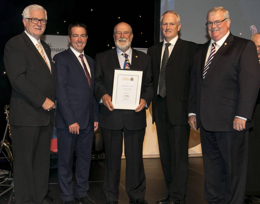 PRESENTATION: A R Bluett Memorial Award Chairman Graeme Fleming, Minister for Local Government Paul Toole and Local Government NSW President Cr Keith Rhoades (right) presented Parkes mayor Cr Ken Keith and Parkes Shire Council's general manager Kent Boyd the prestigious A R Bluett Memorial Award. 