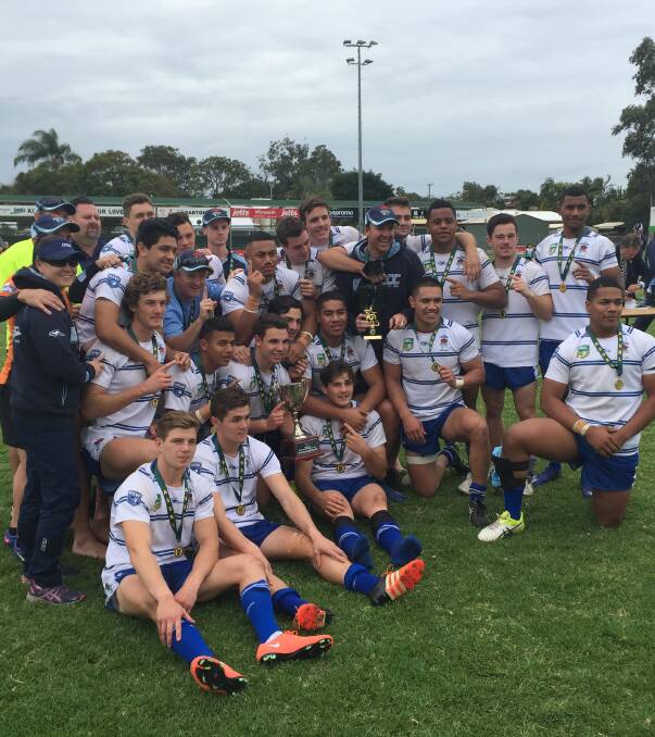 Parkes' Billy Burns (back, centre) and his side, the NSW Combined Catholic Colleges Under 18s Schoolboys, soak up the moment when they won the Australian Schoolboys Championships in Brisbane.