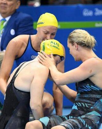 Cate Campbell is comforted by Sweden's Sarah Sjostrom and Denmark's Jeanette Ottesen after her shock 100m loss. Photo: Delly Carr / Swimming Australia Ltd
