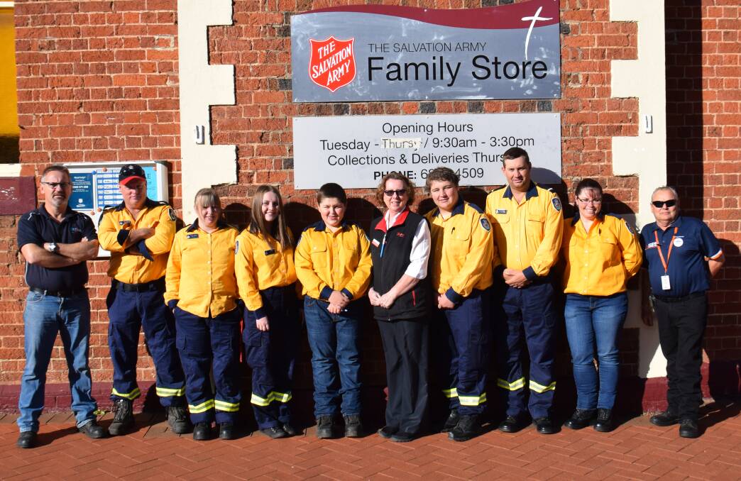 Rosemary Richardson pictured (centre) with the several Rural Fire Service and SES volunteers from the Parkes Shire who helped contribute to this year’s Red Shield Appeal.