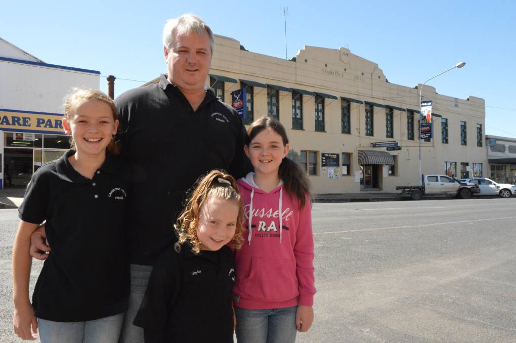 A PLACE TO STAY: Parkes hotelier Matt Coleman - with family friend Charlotte Bullen (10), and daughters Sophia Charlton (5) and Ava Coleman (9) - are offering rooms at the Cambridge Hotel free of charge to Forbes flood victims.