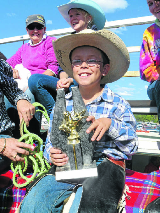 Cody Hall is all smiles after claiming a trophy at the Coonamble Rodeo.