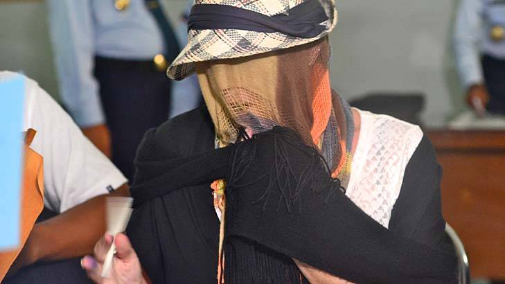Staying in a hotel: Schapelle Corby covered her face when she was released. Photo: Justin McManus 