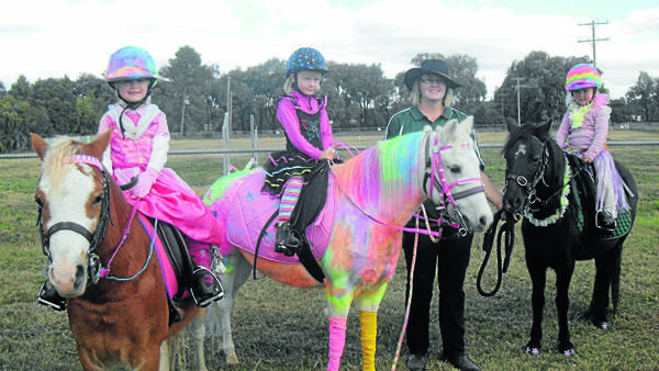 PICTURED are Lara Bennett the Princess,  Breanna Green the Rainbow Pony, Heather Green, and Jade Chellas the Hawian Princess.