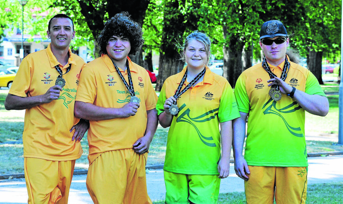 ORANGE: Central West athletes Dean Pallier, Keelan Crawford, Siena Boland and Luke Rout all brought home medals from the Special Olympics Asia Pacific Games. Photo: JUDE KEOGH