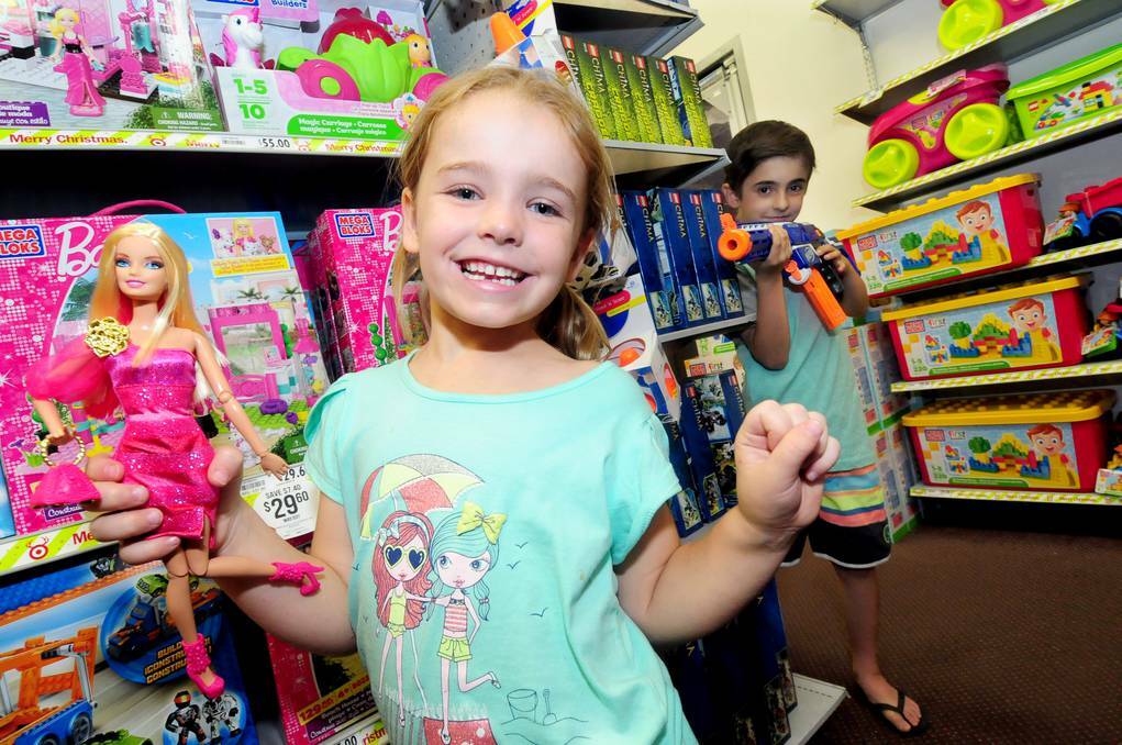 DUBBO: Playing with some of the top five toys for Target in the Orana region is Mia with a Fashionista Barbie doll and Lachlan Rummans with a Nerf Retaliator. Photo: LOUISE DONGES