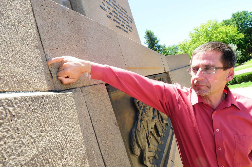 DUBBO: Dubbo City Council horticultural services manager Ian McAlister points to deteriorating mortar at the cenotaph. Photo: LOUISE DONGES