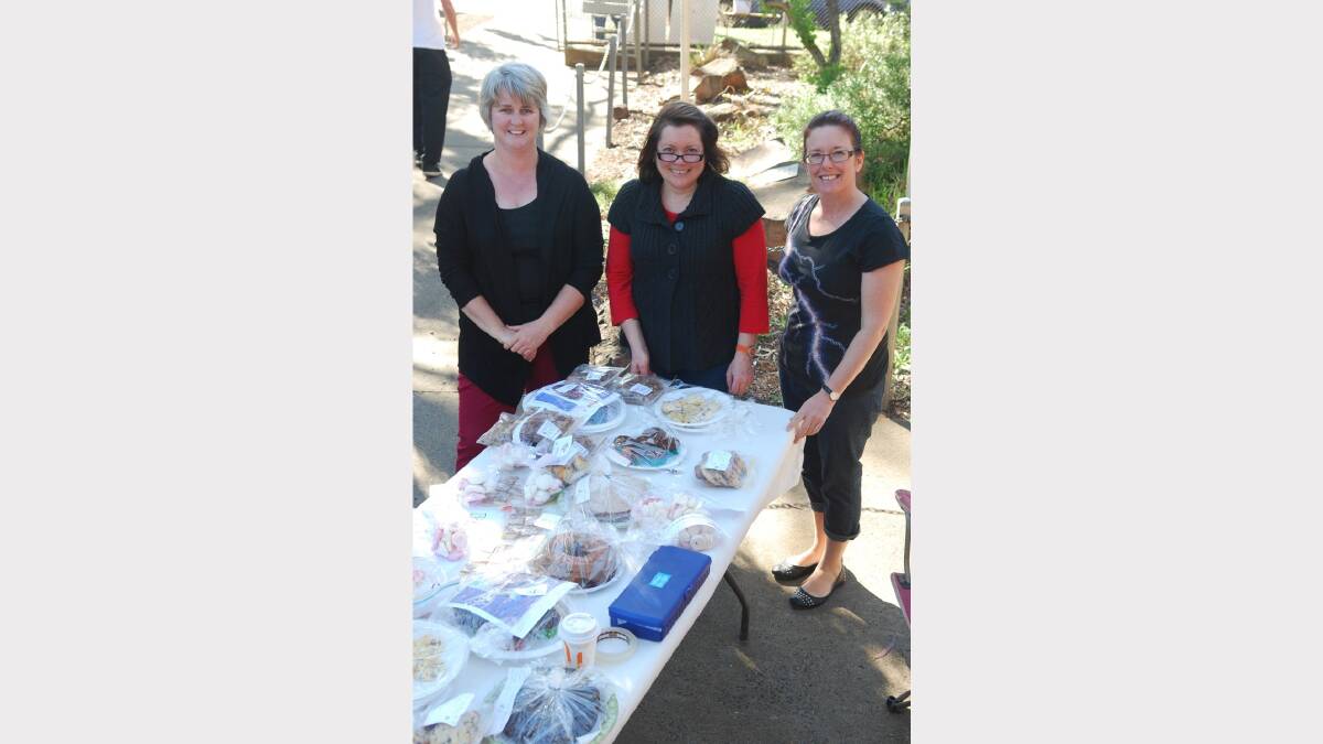 ELECTION 2013: Claire Mackenzie, Sandra Carter and Michelle Allan stocking the cake stall. Photo: Parkes Champion Post