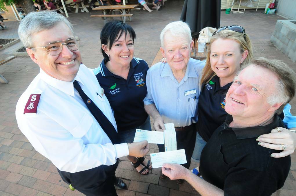 DUBBO: Major Colin Young, Tammy Williamson-Greer, Dan Sullivan, Renee Burgess and Rod Boland embrace the opportunity to help others during the Christmas season. Photo: LOUISE DONGES