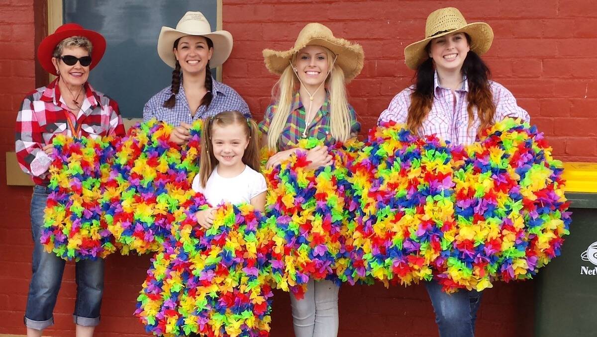 A group of local girls were ready to hand out leis to the train passengers who arrived on the Elvis Express. Photo: Joanne Chatman