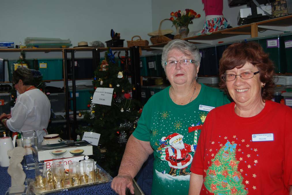  NARROMINE: Bev Cleary and Pauline Newman at the Vinnies store are in the Christmas spirit. 