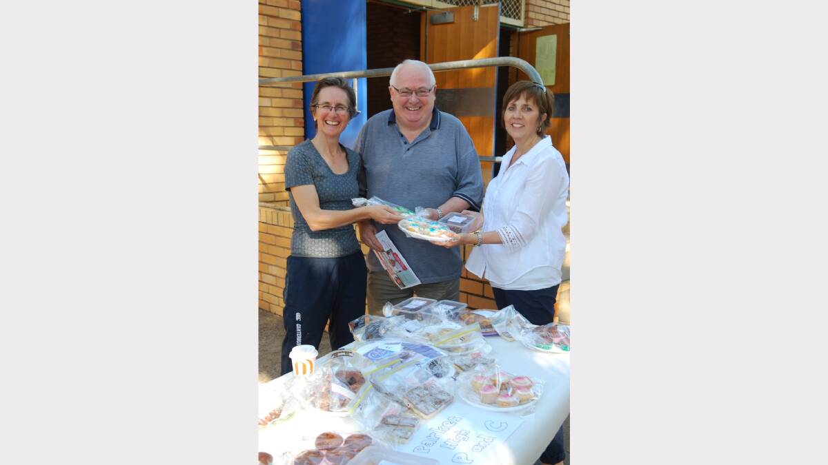 ELECTION 2013: Helen Vere, Ron Dunford and Kim Wilson at the cake stall at Parkes High School. Photo: Parkes Champion Post