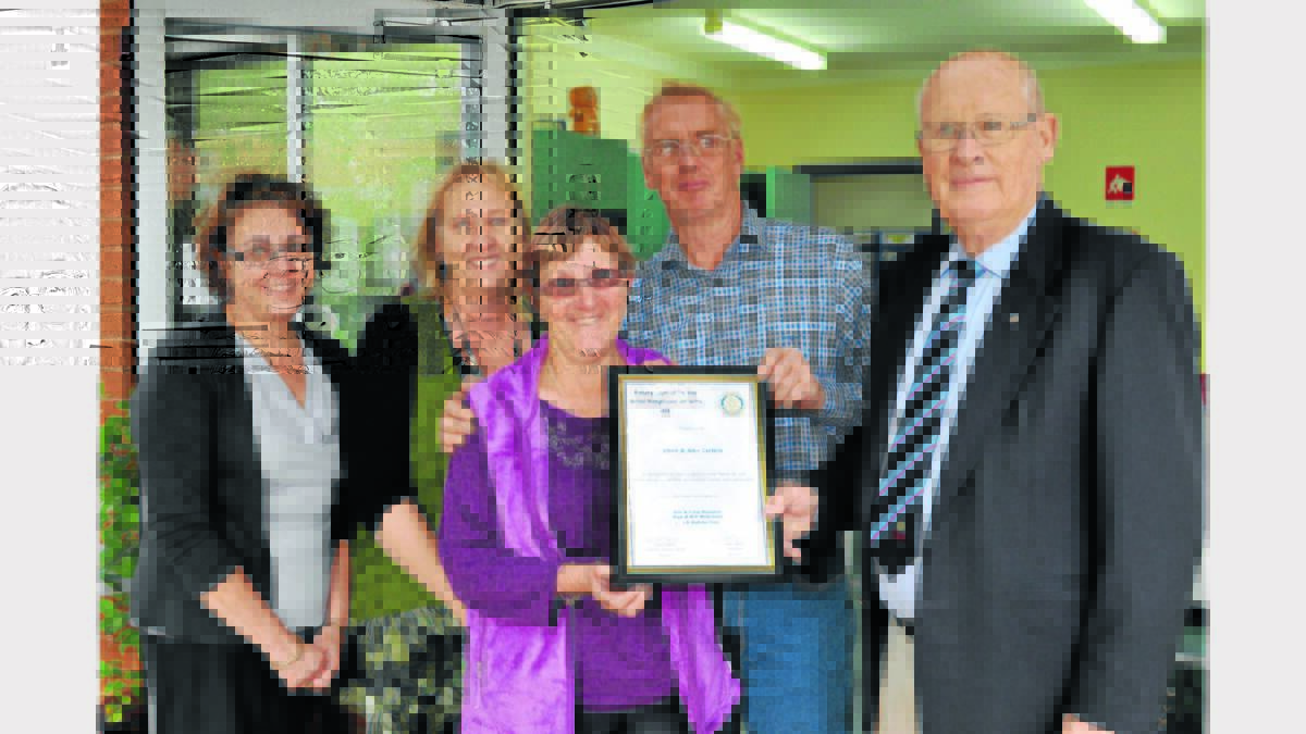 Good Neighbours, Chris and Al Curteir (centre) with nominators, Liza Cope and Julie Macaulay, with Mr Woods. 