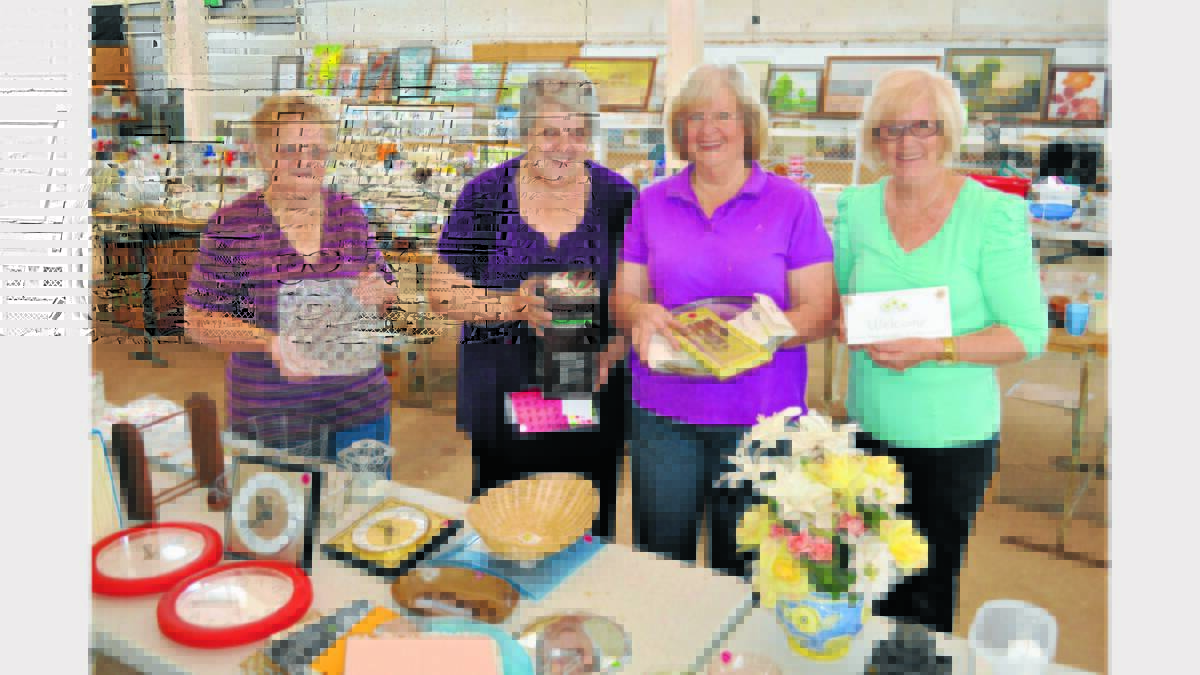 PICTURED this week preparing for tomorrow’s garage sale with some of the huge range of items available are from left, Adrianne Brown, Anne McLachlan, Roslyn Taylor and Colleen Mitchell.    Photo: Bill Jayet.