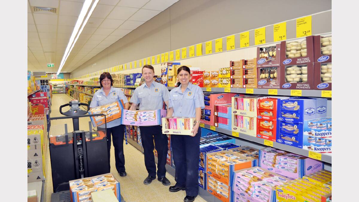 Packing the shelves at Aldi in readiness for Wednesday’s opening - Janine Thomson, Derek Thompson and Michelle MacRae.
