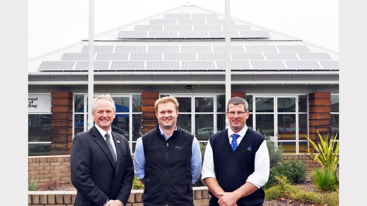 Parkes Shire Council has been at the forefront of promoting solar energy in the shire. General Manager Kent Boyd is pictured (left) with Andrew Francis (Manager Natural Resources) and Brad Byrnes (Manager Governance Corporate Planning) outside the Parkes Shire Library and Cultural Centre – which boasts a 52kW system.    Photo: Bill Jayet   