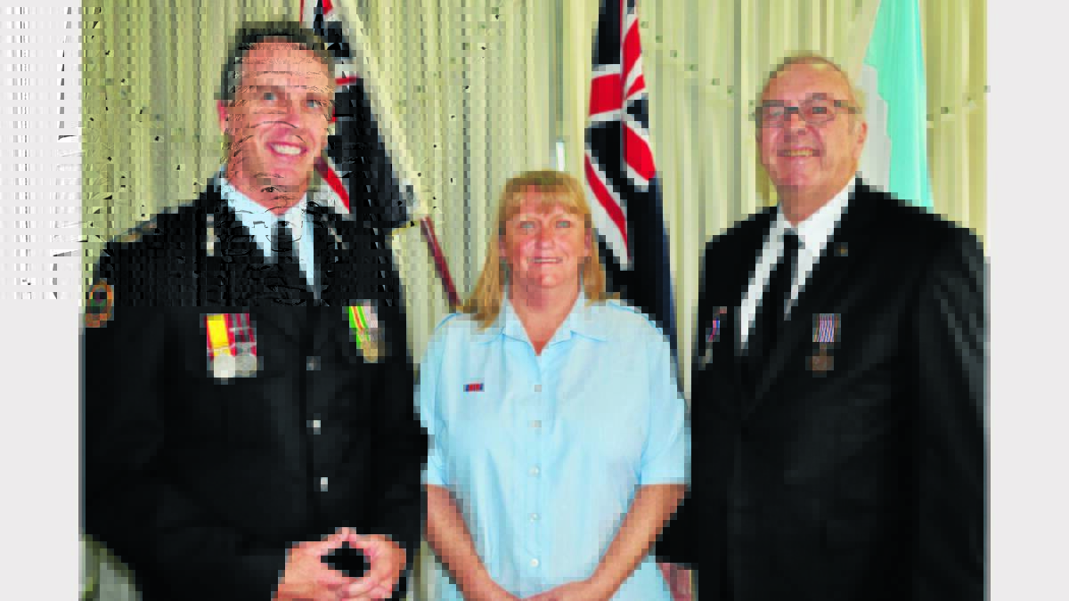 Deputy Commissioner Steven Pearce, State Emergency Service; Sherry Morgan – SES (National Medal for 15 years of service); and Walter Berry – SES (1st Clasp to National Medal for 25 years of service). 