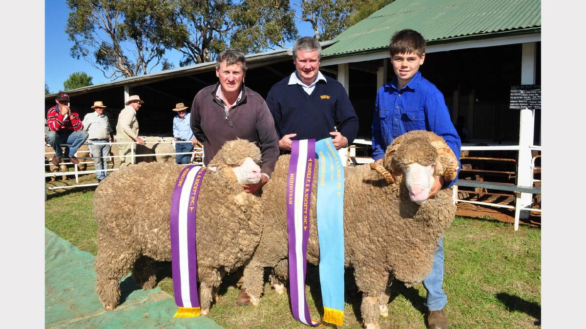 Darriwell Stud again produced the two major results in the sheep judging section; Pictured (from left)  with the Grabd Champion Ewe (18.4 microns) who recently won at the prestigious Bendigo Show – taking out Reserve Champion medium Ewe, Brett Douglass (Schute-Bell) sponsor of the Supreme Exhibit and handler Nicholas Aveyard with the Grand Champion Ram (1.5 ‘Levi’) – the Supreme Exhibit of the Show.