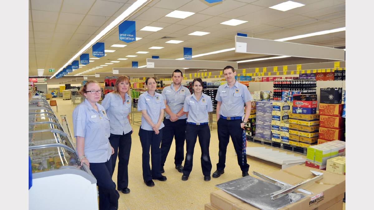 ALDI staff take a breather from packing shelves this week - from left, Naiomi Cox, Donna O’Neill, Tracey Dixon, Nathan Elsley, trainee manager, Katie Warren, and manager Michael Brock.