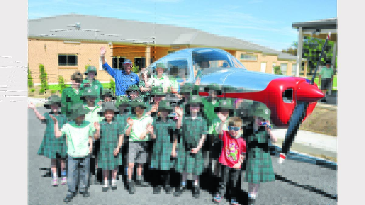 Students at the Parkes Christian School were surprised to see an aeroplane in the playground.  Pilot Ron Watts who is attempting an Australian record in Parkes this Saturday called in to show them the plane he will be flying.