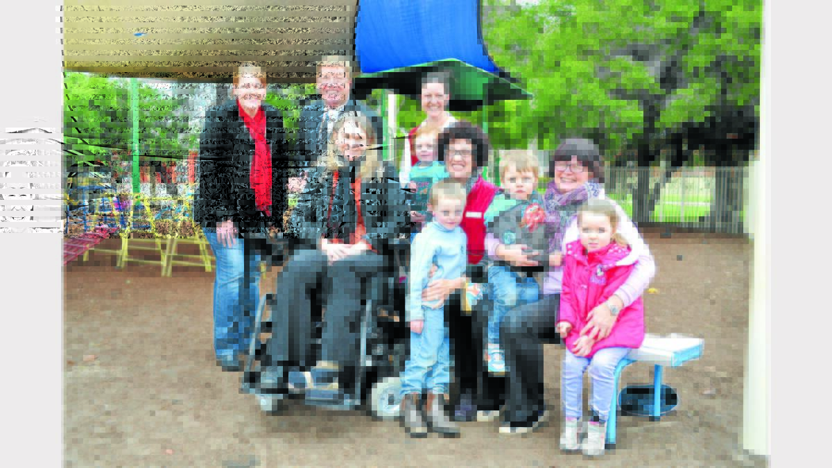 Pictured at the Parkes Early Childhood Centre during a visit by local MP, Troy Grant are from left - back row, parent Kelly Hendry, Troy Grant (Member for Dubbo), parent, Melissa Matthews holding her son Fletcher; and front, parent Tracey Ross, Klancie Green,  Lindy Farrant (PECC Director), Eligh  Symington, Bronnie Dean (teacher) and Clara Rice. The three parents are members of the playground development committee which also has some staff members on it  as well. They are working with Landscape Consultant Sally Bourne. Photo: Barbara Reeves 