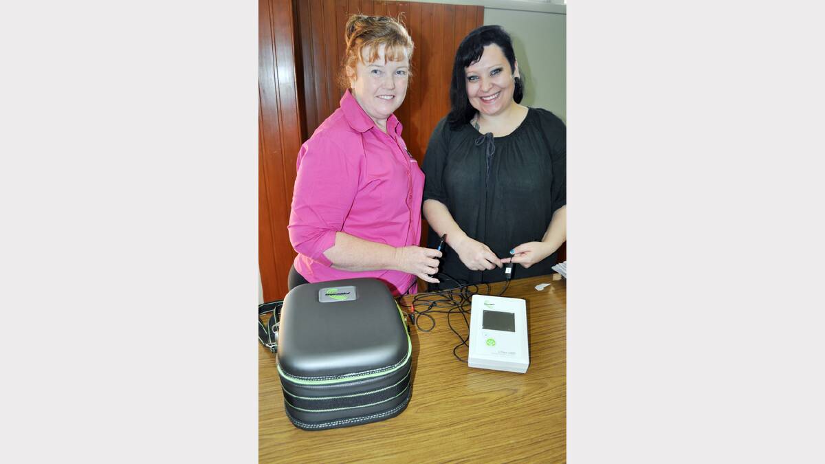 McGrath Breast Care Nurse Dianne Green explains the operations of the L-Dex measurement equipment to Champion Post staff member, Sylvie Maloney.   A special clinic will be held on Monday, July 8. 