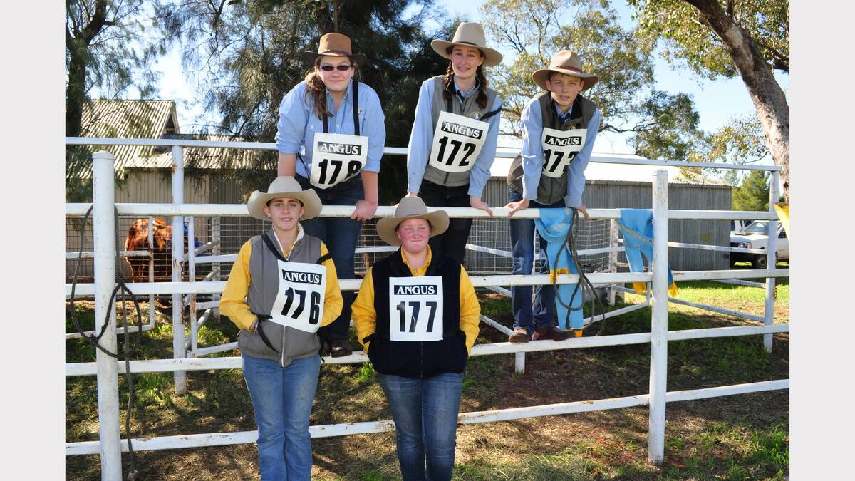 Students from Narromine High School paraded cattle in the Junior section – pictured while fellow competitors competed (back-row, left to right) Sophie Walker, Maddy Preston and Harry Moore; front: Kim Grinsell and Megan Willoughby.