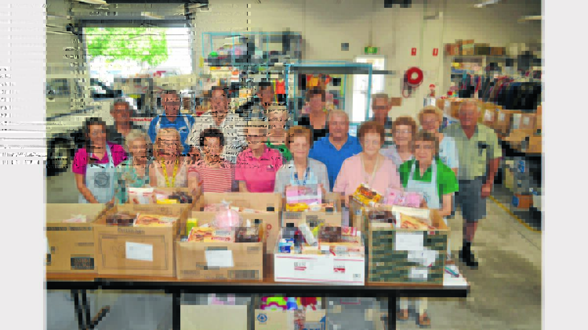 Thank heavens for people like these pictured.    They were down at St Vinnies this week, preparing hampers to deliver to needy local people over Christmas.   As I have said above, Christmas is not easy for many people but receiving a special delivery really cheers them up.  This team, comprising representatives of various local churches and Vinnies, prepared 46 hampers of food and toys.  The hampers, which are delivered by the welfare agencies to their clients, have been organised  since 1992. Christmas is all about giving, and thankfully Parkes is a very giving community which is displayed year in and year out.   Merry Christmas to everyone.     Photo: Barbara Reeves.