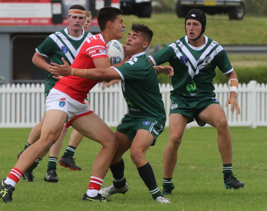 HARD YARDS: Western Rams halfback, Parkes' Jamie Thorpe, looks to make the tackle in their loss to the Illawarra Dragons on Sunday. Photo: ROBERT PEET. 