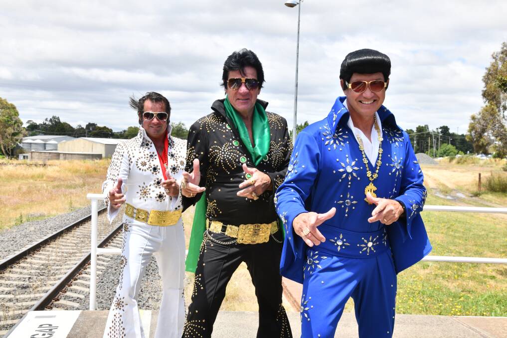 Promotional Elvises Graham Lawrence and Parkes men Al 'Alvis' Gersbach and Greg Jones at East Fork station in Orange, NSW awaiting their Elvis Express lift to the 2023 Parks Elvis Festival. Picture by Carla Freedman
