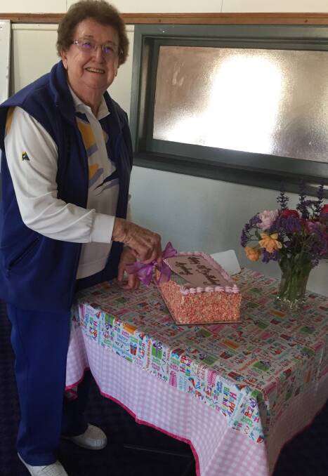 Women's Bowling: Audrey Jones celebrating cutting the cake for her 80th.