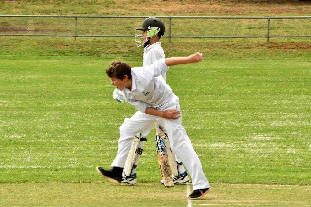 Sixes bowler: Lachlan Plummer sends one down while Ryan Dunford stands by for a run. Photos: Jenny Kingham.