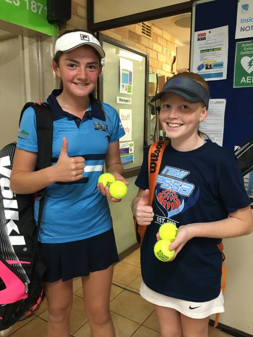Great Work: Olivia Dolbel and Molly Kennedy part of the Coachman Junior Development squad carrying the balls after winning their first round matches at Richmond JT Tournament. The Central West junior development series is an integral component to the development and progress for the players.