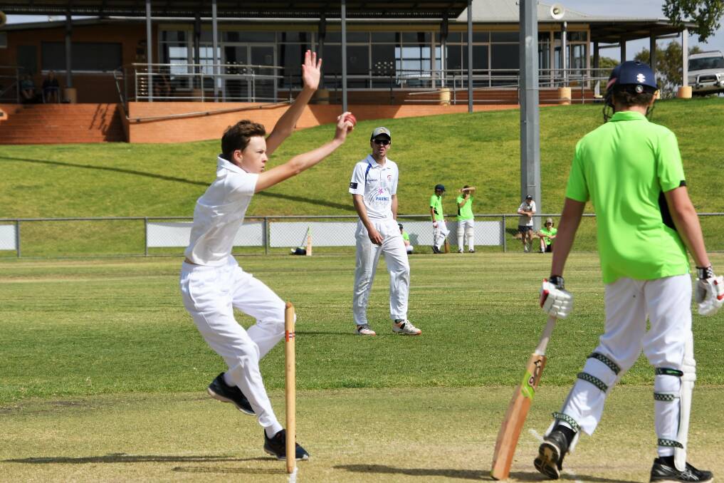 Cracking Cricket Action: Hunter Hawke bowls of Parkes Sixes in a match against Forbes Bernardis IGA.