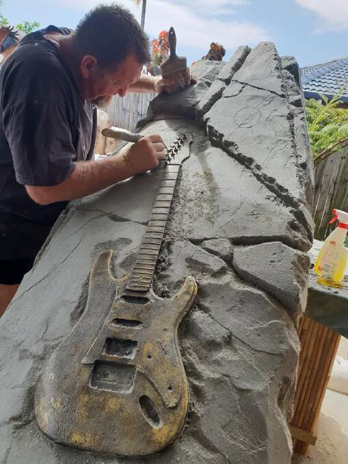 Rod Fletcher from Rocks of Remembrance hard at work creating the memorial stone for Phil Emmanuel. Photo courtesy of Rocks of Remembrance Facebook page.
