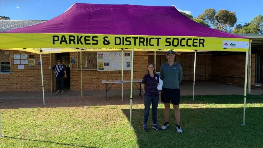 Parkes Soccer's Angela Bottaro-Porter and Wayne Osborne with their new marquee which was purchased from grant funds provided in the last round. 