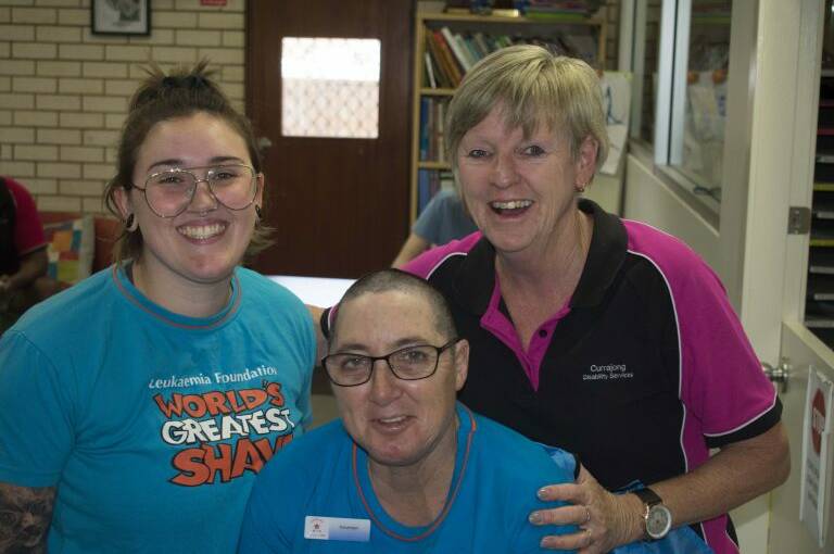 Trilbie Bermingham and Deb Hewitt with Fiona McGonigal after last year's head shave. 