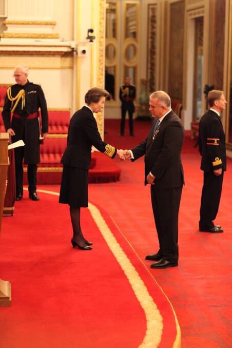 HONOURED: Mr Ken Mulligan receiving his OBE from Princess Anne at Buckingham Palace. Photo: Supplied. 
