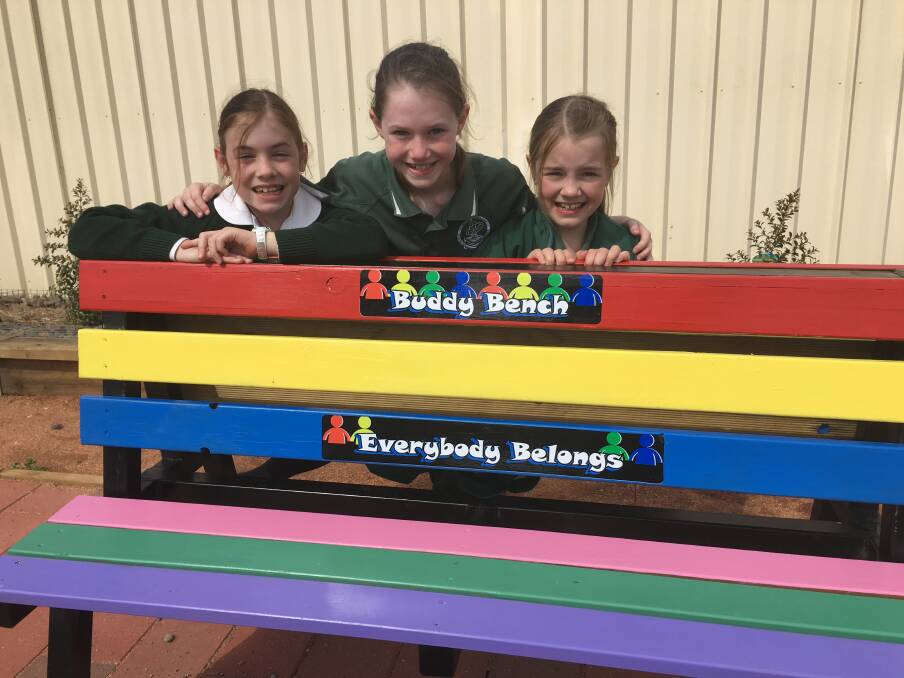 Parkes Christian School students Jasmine Collier, Matilda Wilson and Addison Collier tried out the new Buddy Bench.   