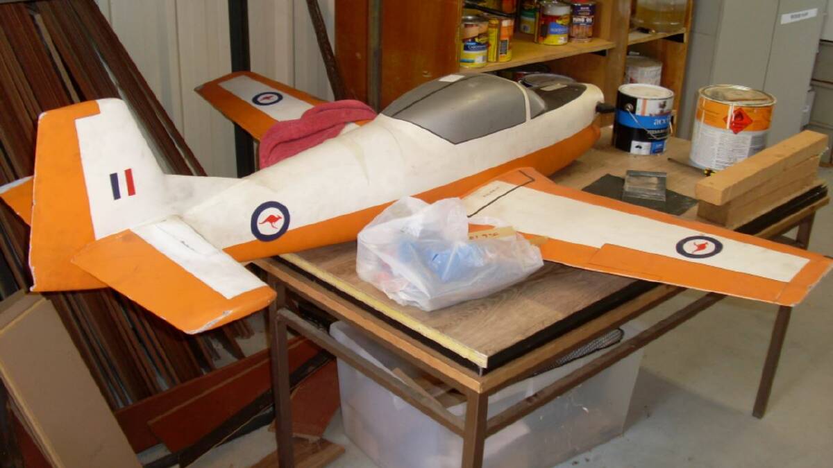 PROJECT: Parkes Men's Shed members are restoring a model aircraft for the Parkes Aviation Museum. Photo: Supplied.