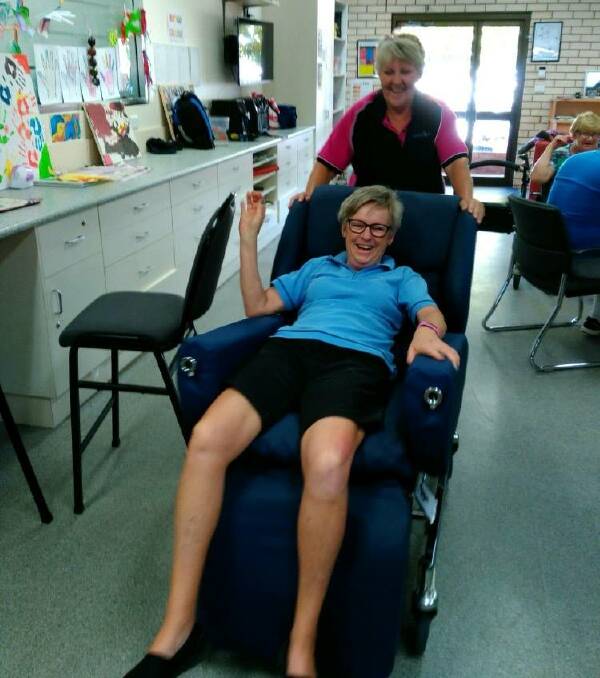 CARE CHAIR: Deb Hewitt tries out the new care chair while Wendy Clothier takes her for a spin. Photo: supplied.
