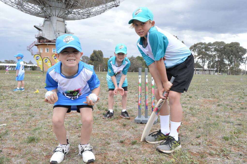 Parkes and District Junior Cricket Association's competition starts on Saturday. Young cricketers Kane Dickerson (7), Harrison Rowbotham (7) and Ewan Moody (10) are already in the mood after helping to launch the Woolworths Cricket Blast program at the Dish on Thursday. Photo by Christine Little.