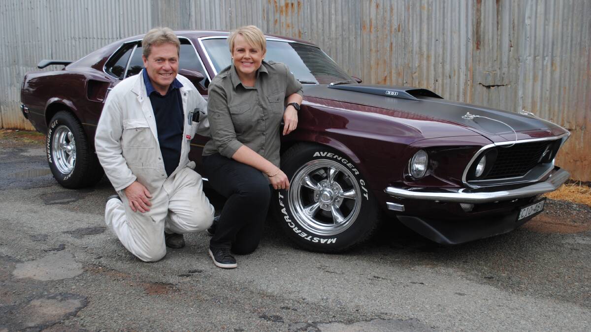 A Must: Dave and Cathy with their Ford Mustang Mach 1 of 1969. After a 12 month rebuild, Dave and his wife Cathy are loving having the Mustang on the road. 