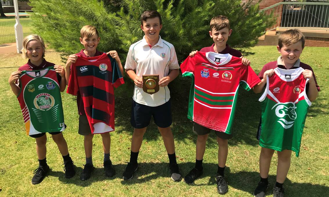 SPORTSMAN OF THE YEAR: Jack Milne (centre) with his Parkes East School mates Lochie Thomas, Will Rix, Nick McPherson and Riley Cronin, who helped him display his Western sport uniforms. Photo: Submitted