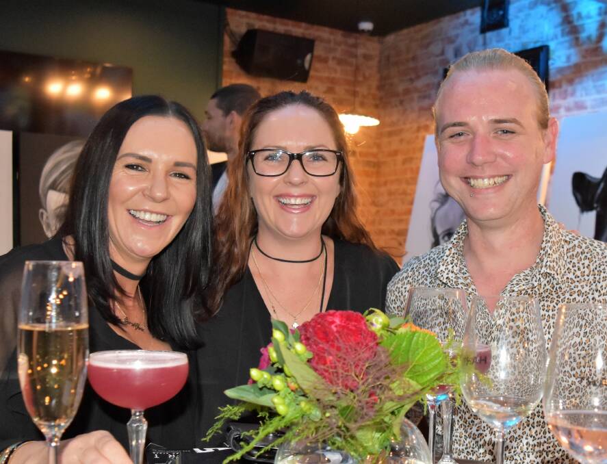 Sarah-Jane Miller, Bec Thomson and Mitchell Cole were all smiles at the official opening of the Railway Hotel's Hart Bar.  