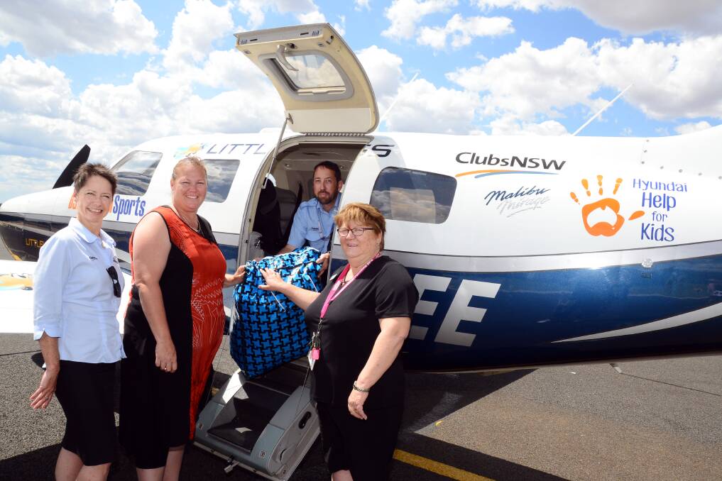 Little Wings business development manager Claudia Steiner, pilot Adam Holt, Amy Cubby and Leanne Thuell, Burnside Western Family Referral Service Dubbo. Photo: Belinda Soole