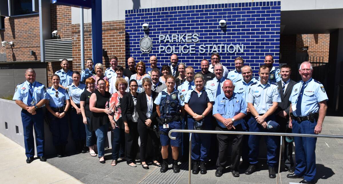 Parkes police officers and civilian staff came together for a photo last Friday to mark the ending of the Lachlan Local Area Command.