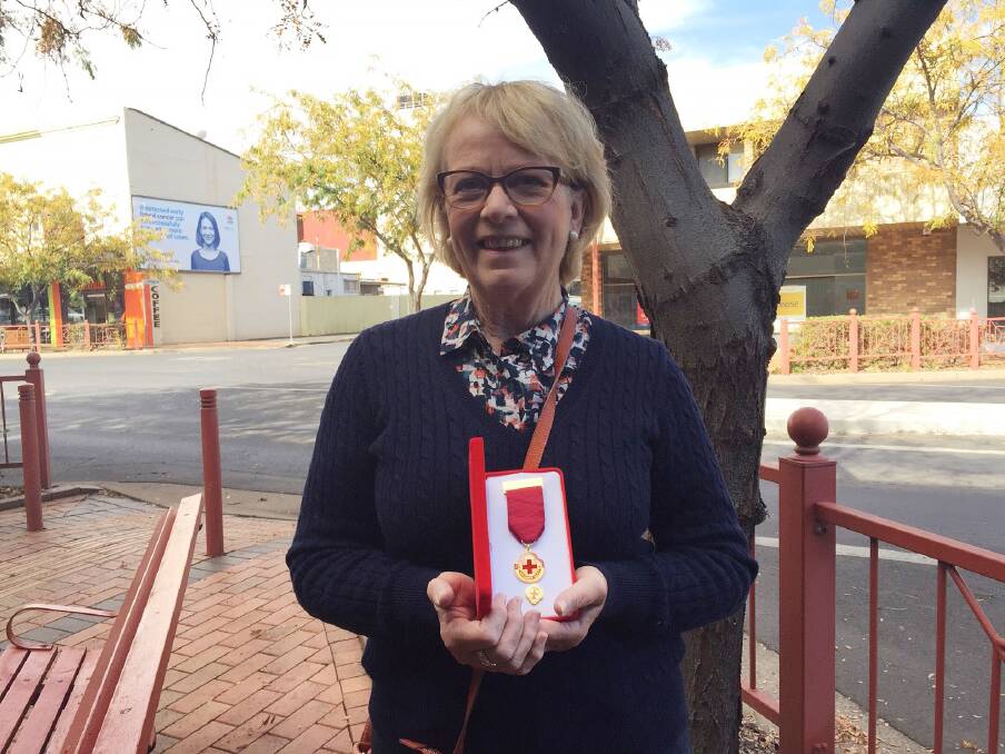 OUTSTANDING: Tomingley's Sue Strahorn holds her Australian Red Cross outstanding service award. Photo: CRAIG THOMSON 