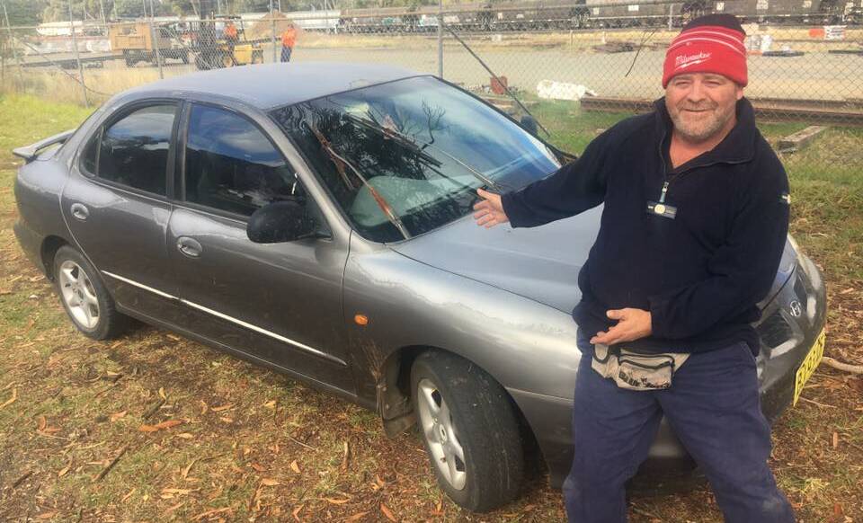 UP FOR GRABS: Australia's Biggest Bogan Festival organiser Brad Gibson has donated this car, now officially called The Bogan Mobile, which will be auctioned off at the event. Photo: Submitted